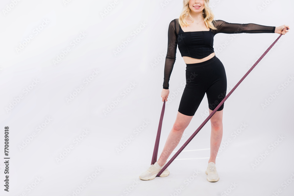 Photo of woman workout with resistance band. Strength and motivation.