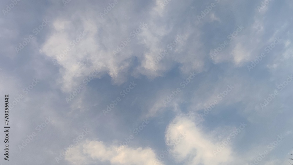 Blue gray light sky nature white clouds whether background , sun face