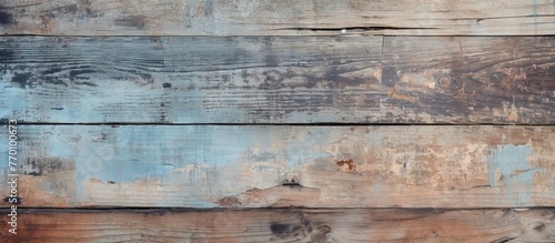 Close-up of a textured wooden wall showing signs of weathering and peeling paint, creating a rustic and aged appearance.