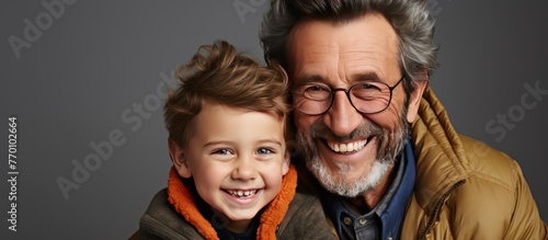 Adult hipster son fun hugging old senior father at home