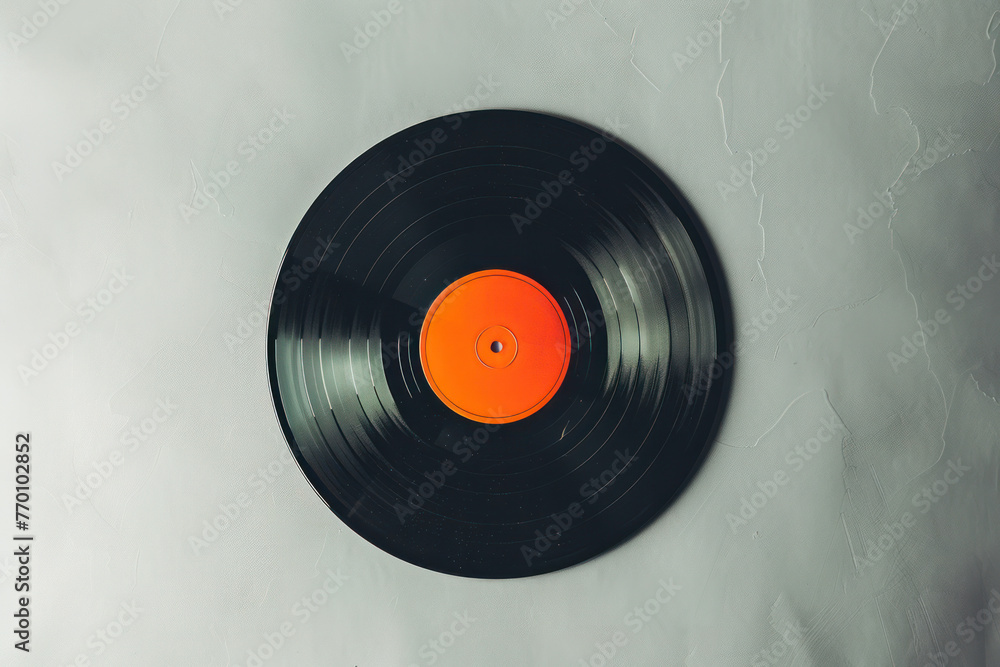 Obraz premium Black and Orange Vinyl Record on White Background