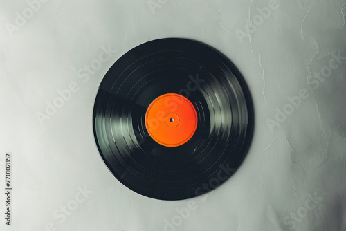 Black and Orange Vinyl Record on White Background photo