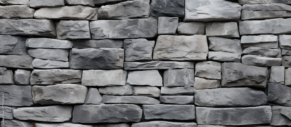 A close up view of a collection of rocks stacked together, set against a black background, creating a striking contrast A close up view of a collection of rocks stacked together, set against a black background, creating a striking contrast