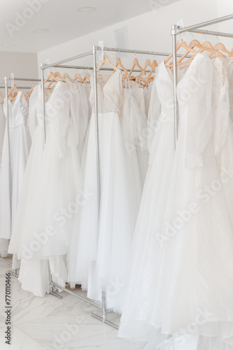 wedding dresses in wedding salon © Anton Pentegov