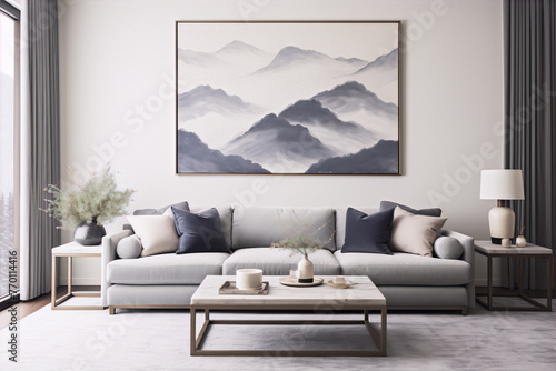 Blue and gray living room with a mountain painting, gray sofa, marble table, plants, and white lamp. © AbbasAmira