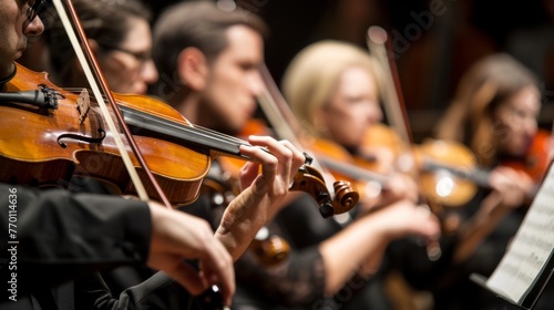 Professional symphony orchestra performing classical music concert on stage with precision