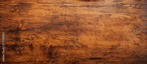A closeup of a hardwood flooring surface with a warm brown and amber wood stain. The rectangle pattern showcases the natural beauty of the beige wood texture photo