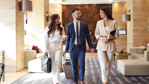 Quadro su tela Young business team going on a business conference at the hotel