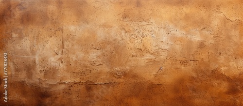 A closeup of a textured brown wall resembling hardwood flooring, with shades of beige and amber creating a rectangular pattern through wood stain