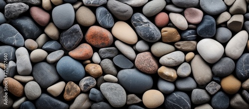A collection of varioussized and colored rocks including bedrock, cobblestone, pebbles, and gravel. These rocks can be used as building materials, for art projects, or as flooring for outdoor spaces