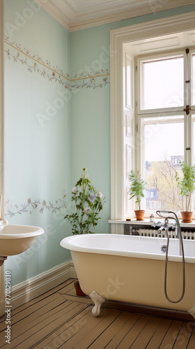 Bathroom in shabby chic style with a clawfoot bathtub, a pedestal sink and floral wallpaper photo