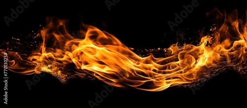 Fire flames on black background photo