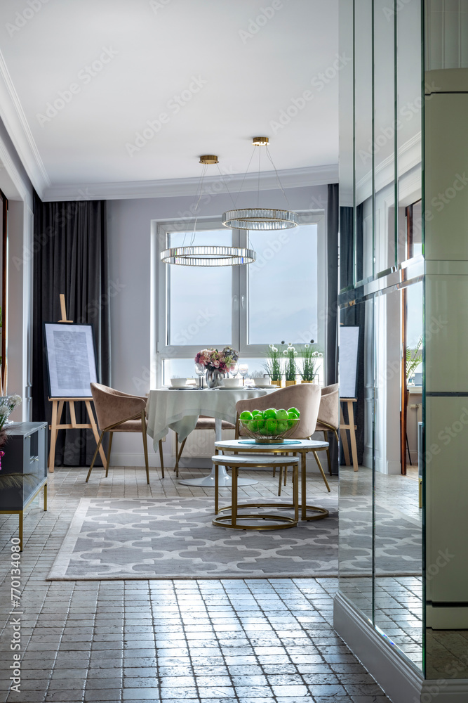 Fototapeta premium Dinning table in stylish, modern apartment