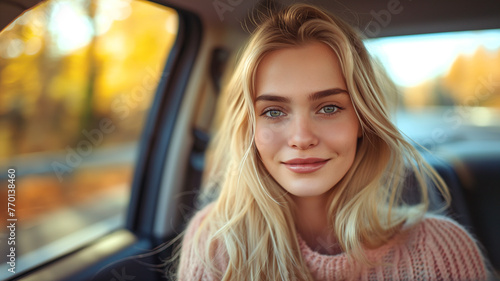 Smiling woman in car © DinoBlue