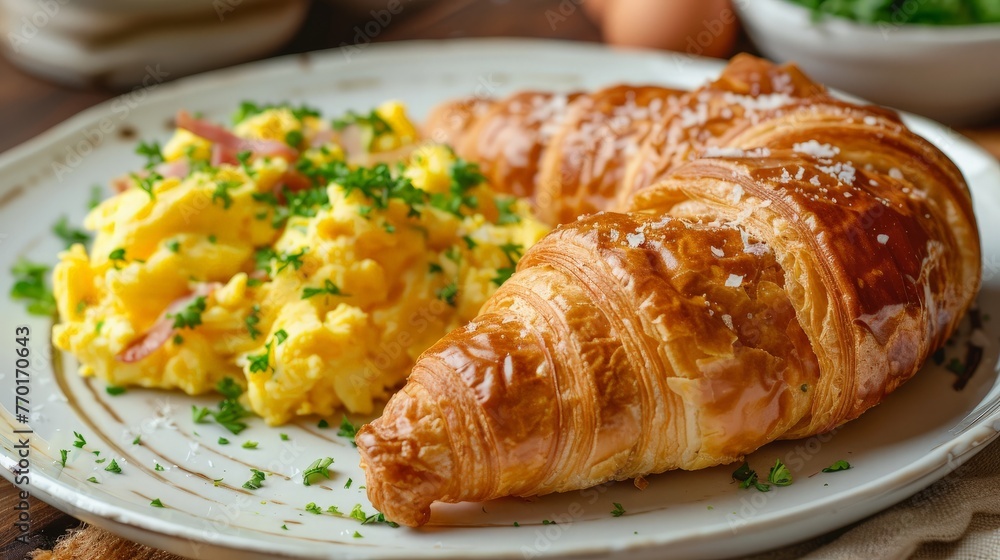 Ham cheese scrambled eggs croissant for breakfast. toning
