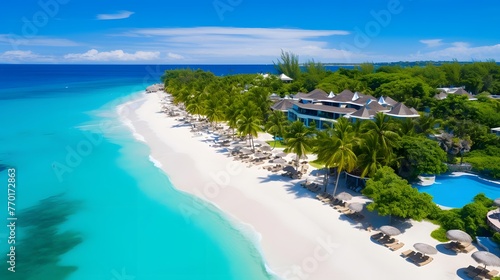 Aerial view of beautiful tropical beach with white sand, turquoise water and blue sky.