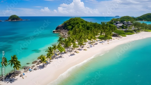 Aerial view of beautiful tropical beach with white sand, turquoise water and coconut palm trees at Seychelles