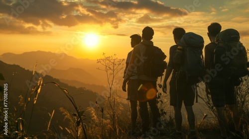 A group of hikers pause on journey taking a moment to appreciate the natural beauty around them with the sunset providing a . .