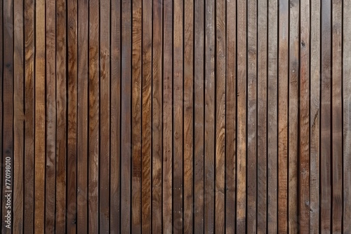 The background of the wall is made up of vertical wood strips with a brown color scheme in a modern wood made living room