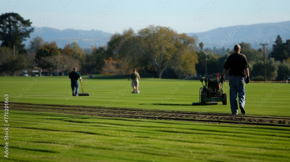 The precision of the grounds crew as they rake and level the field ensuring a smooth playing surface.