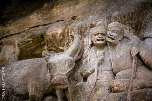 Many buddhist carving at landscape of Dazu rock carving photo