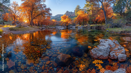 A serene autumn landscape in the Arizona desert, featuring vibrant fall foliage and clear water reflecting colorful trees along a tranquil stream, with rocks visible on its bottom.  Created with Ai photo