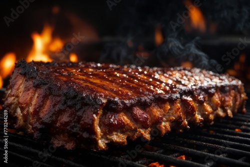 Juicy smoked bbq ribs on fire grill, delicious restaurant food menu