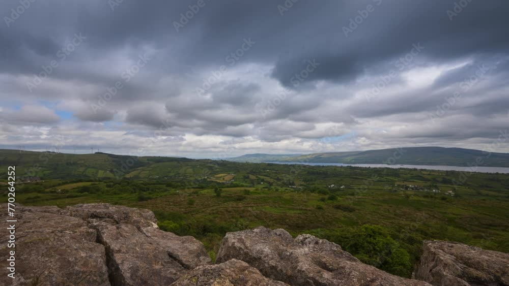 Time lapse of rural landscape with rocky foreground and hills and lake in the distance on a sunny cloudy day in Arigna mountains in county Leitrim in Ireland. Time lapse of rural landscape with rocky foreground and hills and lake in the distance on a sunny cloudy day in Arigna mountains in county Leitrim in Ireland.