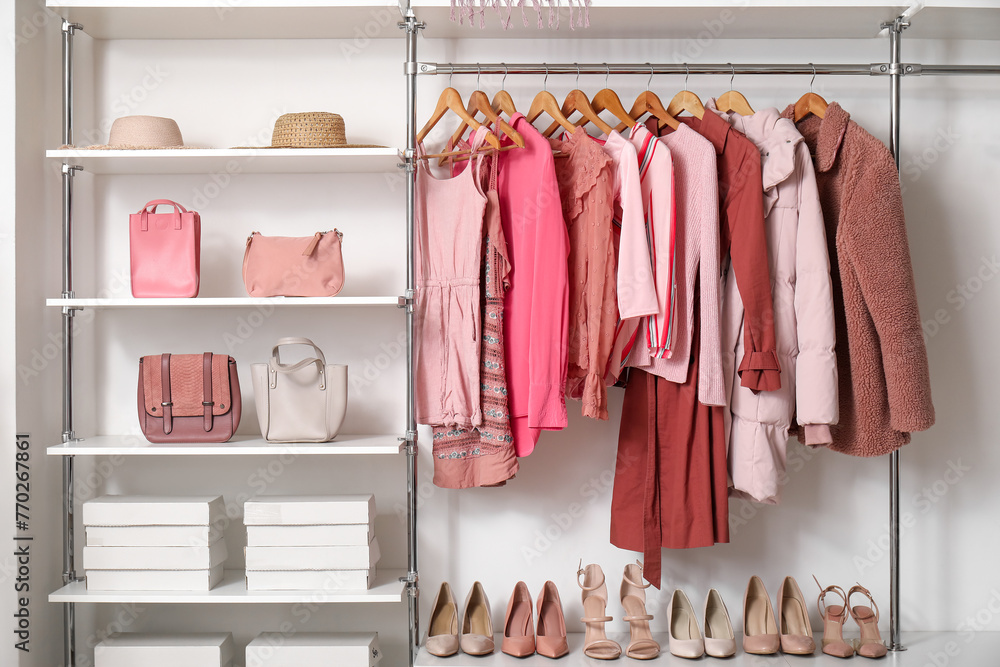 Rack with stylish clothes in modern woman's wardrobe Rack with stylish clothes in modern woman's wardrobe