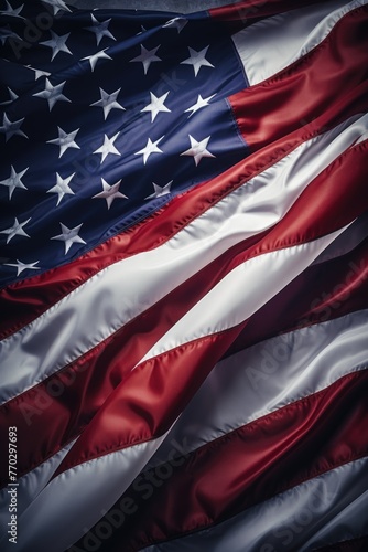 A red, white and blue American flag is shown in a close up. The flag is waving in the wind, and the stars are visible on the top. Concept of patriotism and pride in one's country