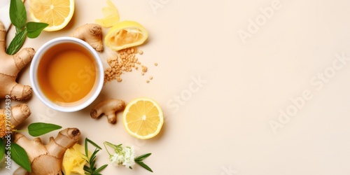 A bowl of tea with lemon slices and ginger on a table. Concept of relaxation and wellness, as the tea