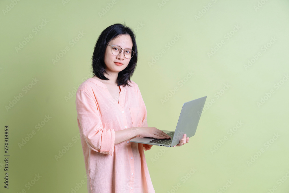 Photo of young Asian woman on background Photo of young Asian woman on background