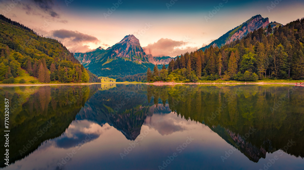 Dramatic summer sunrise on Obersee lake. Calm morning view of Swiss Alps, Nafels village location, Switzerland, Europe. Travel the world.