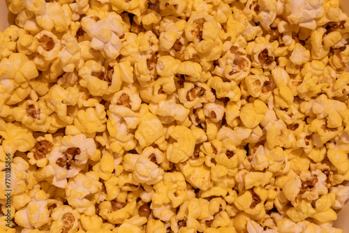 Full frame abstract texture background of golden theater popcorn