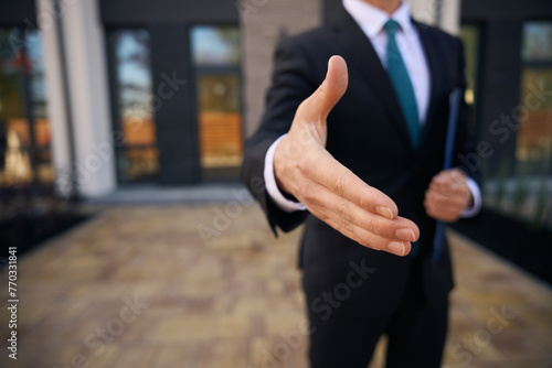 Close up photo of businessman hand before a handshake