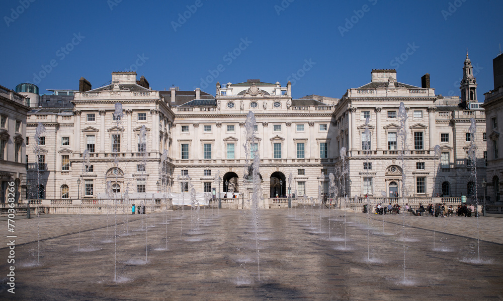 Somerset House in London England. Somerset House is a Neoclassical building on the south side of the Strand in central London, overlooking the River Thames