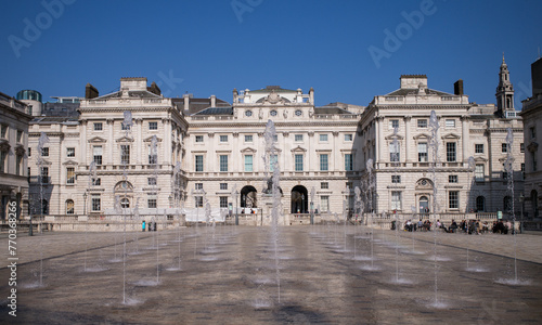Somerset House in London England. Somerset House is a Neoclassical building on the south side of the Strand in central London, overlooking the River Thames