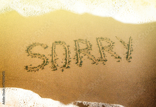 Summer sea beach, the inscription on the sand sorry