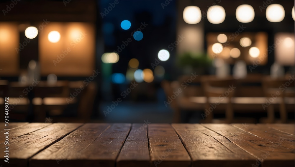 empty wooden table with blurred bokeh background of night cafe