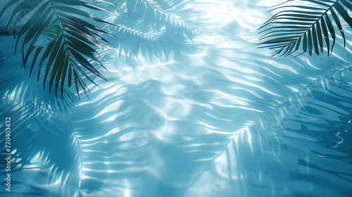 Photo of palm leaves from above, which cast a shadow on the clean and transparent sea water. Summer background