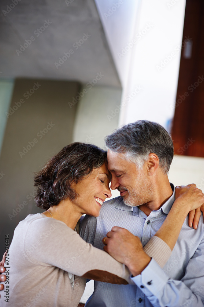 Love, trust and mature couple hug in house with care, support or soulmate connection while bonding. Happy, safety or people embrace at home for romance, security or sharing moment, dance or gratitude Love, trust and mature couple hug in house with care, support or soulmate connection while bonding. Happy, safety or people embrace at home for romance, security or sharing moment, dance or gratitude