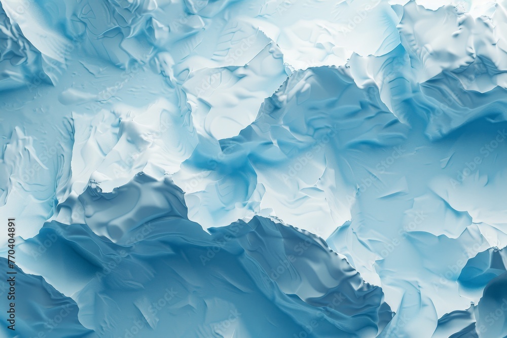 A large ice block is sitting on a blue surface