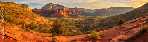 Red sandstone rock formations with layers visible at sunset. photo