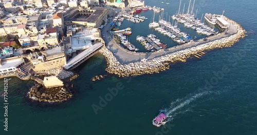 Panoramic Aerial View of Acco, Acre, Akko old city with crusader palace, city walls, arab market, knights hall, crusader tunnels, in Israel. Green Roof Al Jazzar Mosque photo