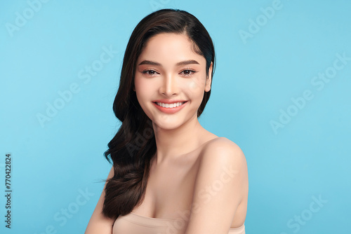 Beautiful Young transgender woman with clean fresh skin on blue background, Face care, Facial treatment, Cosmetology, beauty and spa, transgender women portrait.