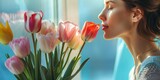 Bright and colorful tulips in sunlight with a woman appreciating the fresh bloom, depicting spring and happiness. Generated AI
