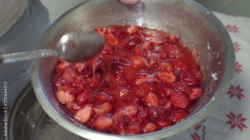 strawberries with sugar in a bowl, cooking jam from delicious red berries strawberries with sugar in a bowl, cooking jam from delicious red berries