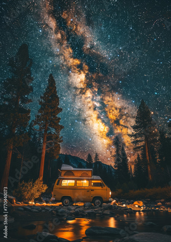 Camper van parked at night in national park. Milky way in the night sky. Outdoors. Adventure. Travel. Atmospheric ambient lighting. Van life. Explorers. 