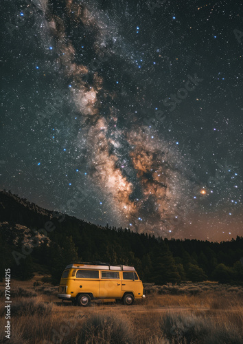 Camper van parked at night in national park. Milky way in the night sky. Outdoors. Adventure. Travel. Atmospheric ambient lighting. Van life. Explorers. 
