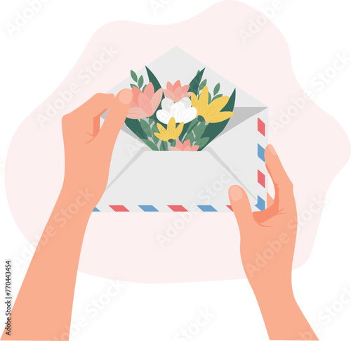  hands holding an envelope with flowers